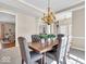 Spacious dining area with a large table, stylish chairs, and plenty of natural light at 8717 Vintner Ct, Indianapolis, IN 46256