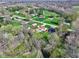 An aerial view of the home's neighborhood surrounded by trees, grass, and other homes at 8745 Big Bend Rd, Martinsville, IN 46151