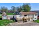 Exterior view of home featuring wood deck, basement access and vinyl siding at 8745 Big Bend Rd, Martinsville, IN 46151