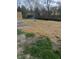 The backyard of the home is very large and mulched with straw at 8745 Big Bend Rd, Martinsville, IN 46151