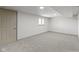 Cozy basement area with a door, window, and neutral carpeting, ready for customization at 8745 Big Bend Rd, Martinsville, IN 46151