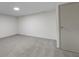 Unfinished basement featuring neutral walls, carpeting, and ample natural light from a small window at 8745 Big Bend Rd, Martinsville, IN 46151