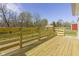 A wooden deck with wood railing overlooks the exterior at 8745 Big Bend Rd, Martinsville, IN 46151