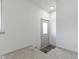 Inviting entryway features carpet, wood flooring, and a glass-paneled front door at 8745 Big Bend Rd, Martinsville, IN 46151