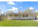 Charming ranch-style home with a covered front porch and spacious front yard at 8745 Big Bend Rd, Martinsville, IN 46151