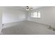Bright living room with a ceiling fan and neutral carpet at 8745 Big Bend Rd, Martinsville, IN 46151