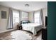 Bright bedroom with neutral tones, plush rug, and ample natural light at 89 E Walnut St, Fountaintown, IN 46130