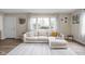 Spacious living room with comfortable seating and large windows for plenty of sunlight at 89 E Walnut St, Fountaintown, IN 46130