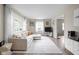 Bright living room featuring a comfortable sectional sofa and ample natural light at 89 E Walnut St, Fountaintown, IN 46130