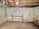 Basement with exposed utilities and block walls, providing a blank canvas for various improvements at 918 N Dearborn St, Indianapolis, IN 46201