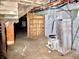 A glimpse into the basement showing utilities, and a concrete foundation awaiting renovation at 918 N Dearborn St, Indianapolis, IN 46201