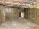 Unfinished basement reveals exposed ceiling, utility lines, and concrete floor, ready for customization at 918 N Dearborn St, Indianapolis, IN 46201