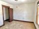 Bright bedroom featuring original trim details and a glimpse of natural light at 918 N Dearborn St, Indianapolis, IN 46201