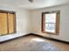 Bedroom with peeling walls and outdated windows offers a canvas for transformation and renovation at 918 N Dearborn St, Indianapolis, IN 46201