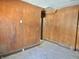 Dining Room shows faded wood paneling and worn floors, suggesting a need for renovation at 918 N Dearborn St, Indianapolis, IN 46201