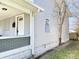 The light gray house features horizontal siding, white trim, and a covered porch at 918 N Dearborn St, Indianapolis, IN 46201