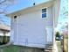 The light gray home features horizontal siding, white trim, and a clean exterior at 918 N Dearborn St, Indianapolis, IN 46201