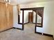 Living room with hardwood floors, doorway to stairs at 918 N Dearborn St, Indianapolis, IN 46201