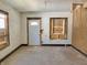 Living room with hardwood floors, window and door to the front yard at 918 N Dearborn St, Indianapolis, IN 46201