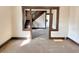 The living room features hardwood floors, with a staircase leading up, ready for customization at 918 N Dearborn St, Indianapolis, IN 46201