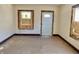 Bright living room with entry door, showing natural light, and potential for renovation and personalization at 918 N Dearborn St, Indianapolis, IN 46201