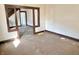 Spacious living room featuring original wood trim, potential for renovation, and abundant natural light at 918 N Dearborn St, Indianapolis, IN 46201