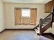 Living room showcasing natural light and staircase, presenting an opportunity for customization at 918 N Dearborn St, Indianapolis, IN 46201