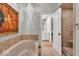Bathroom featuring a soaking tub and walk-in shower at 958 Tamarack Cir N Dr, Indianapolis, IN 46260