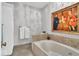 Elegant bathroom with a soaking tub and tiled accents at 958 Tamarack Cir N Dr, Indianapolis, IN 46260