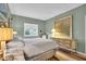 Bright bedroom featuring a comfortable bed, dresser, and view from the window for a serene atmosphere at 958 Tamarack Cir N Dr, Indianapolis, IN 46260