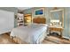 Inviting bedroom with a well-made bed, stylish lamps, and elegant décor for a peaceful retreat at 958 Tamarack Cir N Dr, Indianapolis, IN 46260