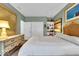 Cozy bedroom with a classic dresser, comfortable bed, and ample storage with sliding closet doors at 958 Tamarack Cir N Dr, Indianapolis, IN 46260