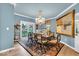 Formal dining room with a chandelier, large painting, and seating for six at 958 Tamarack Cir N Dr, Indianapolis, IN 46260