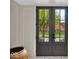 Elegant double front doors with glass panels offering a view to the exterior landscape at 958 Tamarack Cir N Dr, Indianapolis, IN 46260