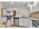 Kitchen area with stainless steel dishwasher, granite counters, and eat-in dining area at 958 Tamarack Cir N Dr, Indianapolis, IN 46260