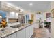 Spacious kitchen with granite countertops, stainless steel appliances, and white cabinetry at 958 Tamarack Cir N Dr, Indianapolis, IN 46260
