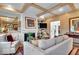 Bright living room featuring a fireplace, hardwood floors, and an adjacent bar area at 958 Tamarack Cir N Dr, Indianapolis, IN 46260