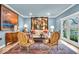 Stylish living room featuring blue walls, hardwood floors, and elegant furnishings at 958 Tamarack Cir N Dr, Indianapolis, IN 46260
