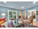 Elegant living room featuring plush seating, a stylish rug, and abundant natural light at 958 Tamarack Cir N Dr, Indianapolis, IN 46260