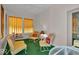 Bright sunroom with vibrant decor, comfortable seating, and lots of natural light at 958 Tamarack Cir N Dr, Indianapolis, IN 46260