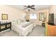 Bedroom featuring neutral-toned walls, carpeted floor, and a queen-size bed with decorative throw pillows at 963 Wickham Ct # 103, Carmel, IN 46032