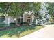 An attractive clubhouse featuring mature trees, manicured lawns, and inviting architecture at 963 Wickham Ct # 103, Carmel, IN 46032