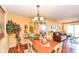 Cozy dining room featuring hardwood floors and stylish decor, connecting seamlessly to the inviting living room at 963 Wickham Ct # 103, Carmel, IN 46032