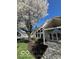 Attractive community building with a meticulously maintained lawn and a mature Bradford Pear tree at 963 Wickham Ct # 103, Carmel, IN 46032