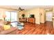 Inviting living room with hardwood flooring, providing access to an outdoor area and featuring a cozy seating arrangement at 963 Wickham Ct # 103, Carmel, IN 46032
