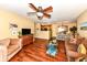 Spacious living room with hardwood floors, offering an open concept layout connecting the kitchen, dining and living areas at 963 Wickham Ct # 103, Carmel, IN 46032