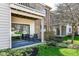 Private patio provides an inviting space to relax with comfortable seating and garden views at 963 Wickham Ct # 103, Carmel, IN 46032