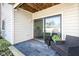 Private patio provides an inviting space to relax with comfortable seating and garden views at 963 Wickham Ct # 103, Carmel, IN 46032