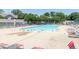 Community swimming pool surrounded by lounge chairs offers a refreshing escape on warm days at 963 Wickham Ct # 103, Carmel, IN 46032