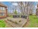 Outdoor wooden deck featuring bench seating and multiple grills, perfect for entertaining guests at 102 Knoll Ct # D, Noblesville, IN 46062